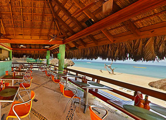 scotch bonnet bar during the day next to the beach