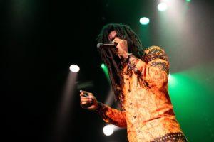 man performing reggae on stage